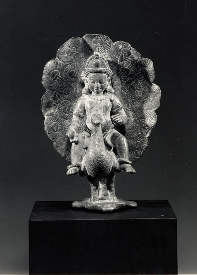 Gilt-copper sculpture of the war god Kartikeya (Kumara) seated on his peacock mount